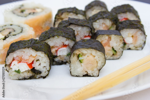 Japanese cuisine, rice sushi and fish - closeup