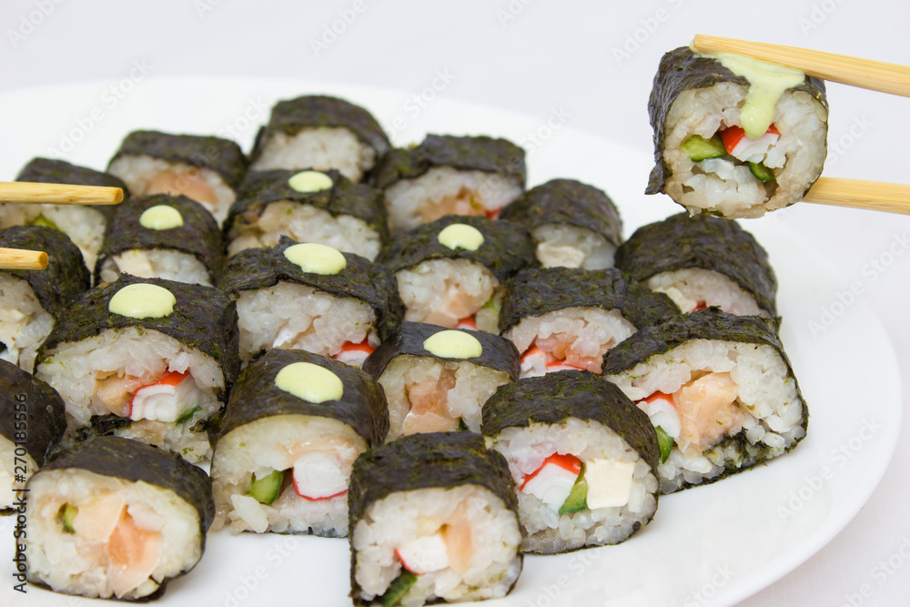 Japanese cuisine, rice sushi and fish - closeup Japanese cuisine, rice sushi and fish - closeup