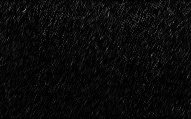 Falling raindrops isolated on dark background. Heavy rain and weather storm in raining season.