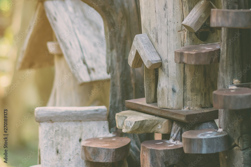Hand made wooden bird house nest in public Park , hand wood shelter for birds . Hand made wooden bird house nest in public Park , hand wood shelter for birds .