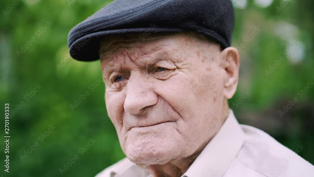 Very old caucasian man portrait. Grandfather is sad. Portrait: aged, elderly, loneliness, senior with lot of wrinkles on face. Close-up of a pensive old man sitting alone outdoors. Very old caucasian man portrait. Grandfather is sad. Portrait: aged, elderly, loneliness, senior with lot of wrinkles on face. Close-up of a pensive old man sitting alone outdoors.