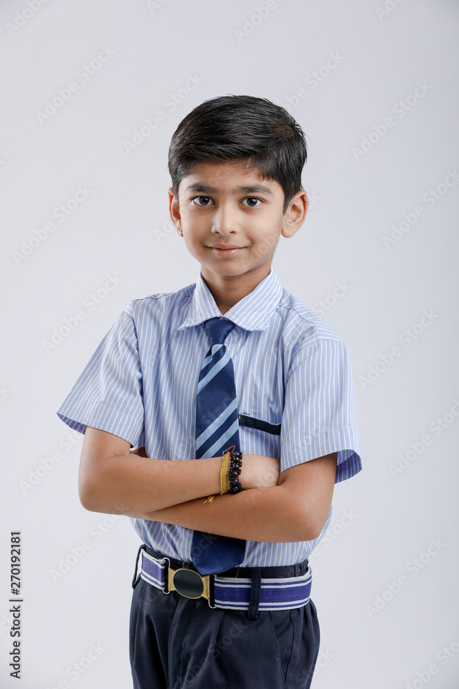 Cute little indian Indian / Asian school boy wearing uniform Cute little indian Indian / Asian school boy wearing uniform