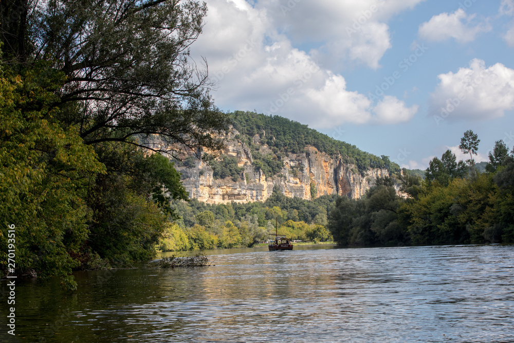  A tourist boat, in French called gabare, on the river Dordogne at La Roque-Gageac, Aquitaine, France