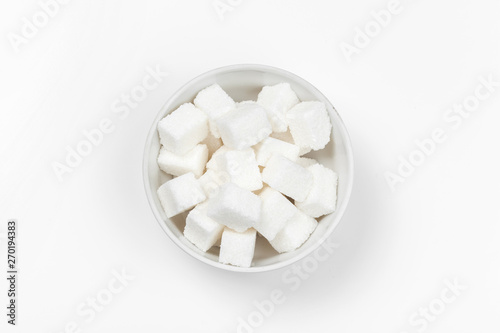 Group of refined white sugar cubes close up