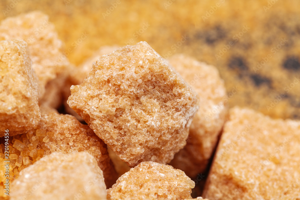 Brown cane sugar cubes isolated on white background Brown cane sugar cubes isolated on white background