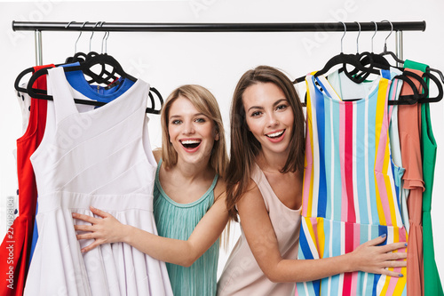 Two cheerful pretty young girls isolated