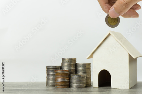 Saving money, home loan, mortgage, a property investment for future concept. photo