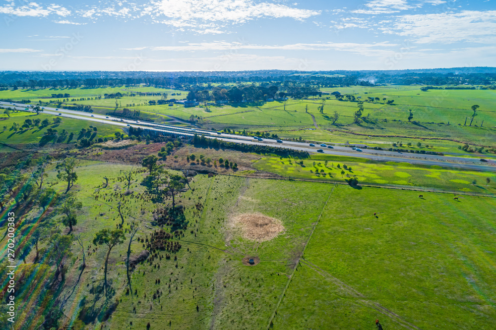 Aerial view of green pastures and rural highway at Mornington Peninsula Victoria, Australia