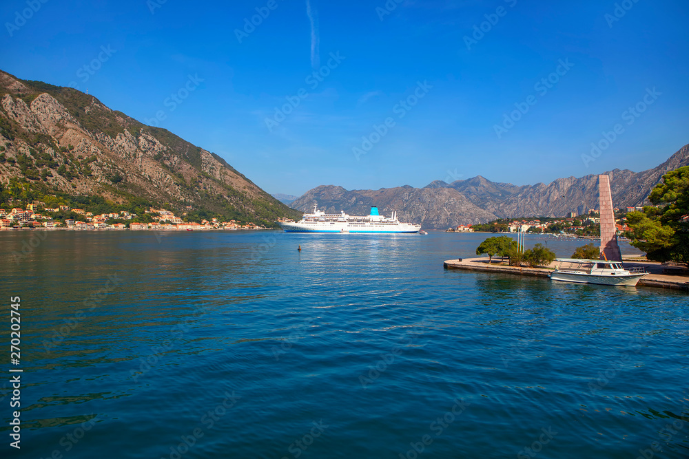large cruise liner in the bay , landscape with mountains and Kotor Bay 