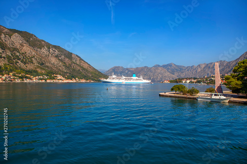 large cruise liner in the bay , landscape with mountains and Kotor Bay 