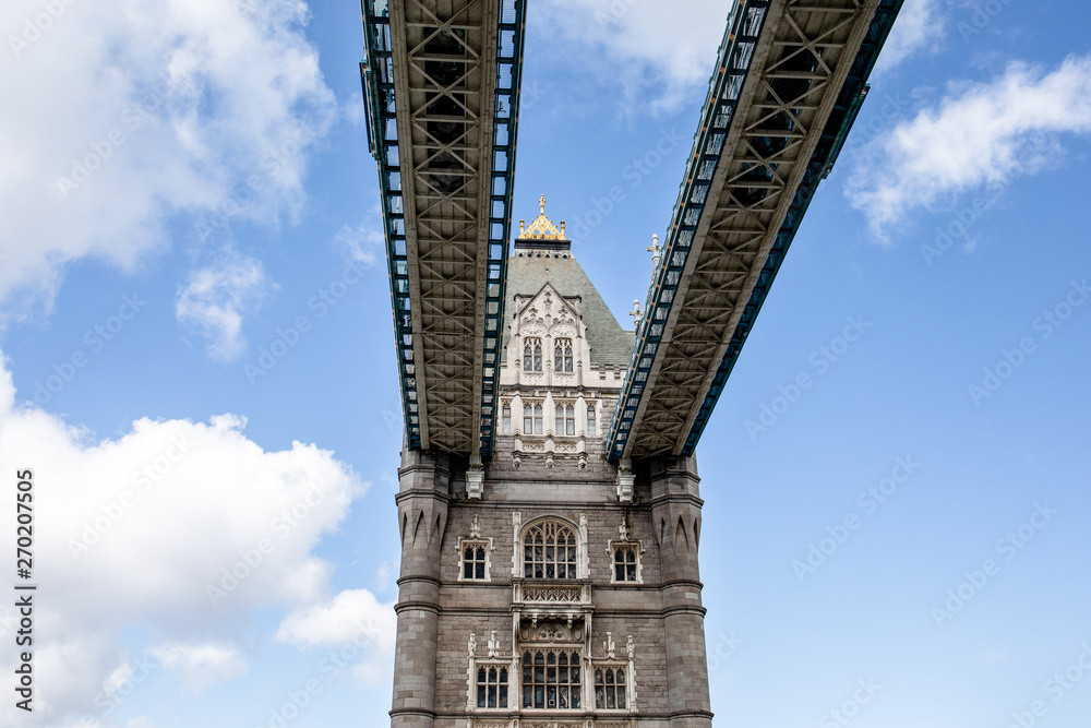 Tower bridge in London, Great Britain. Blue sky and white clouds