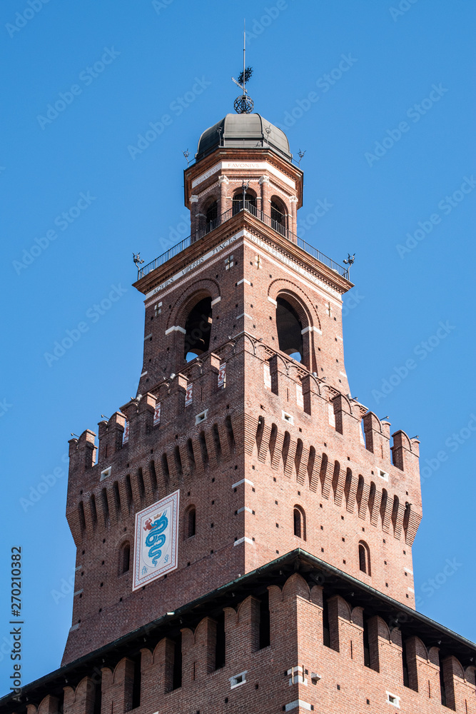 Milan, Italy: the biscione, an azure serpent in the act of consuming a human, the emblem of the House of Visconti and of the city from the 11th century, on the Filarete Tower of the Sforza Castle