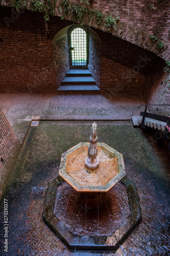 Milan, Sforza Castle: view of Cortile della Fontana, the fountain court, little courtyard in the Museum of ancient art housing works ranging from the early Christian age to XVI century photo