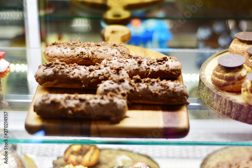 Sweet desserts and cakes in a vitrine of a cafe