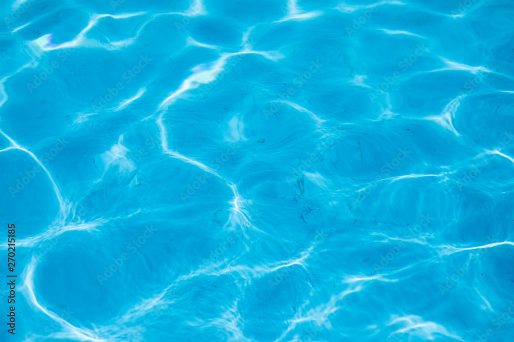 Blue water of a swimming pool. Summer image.
