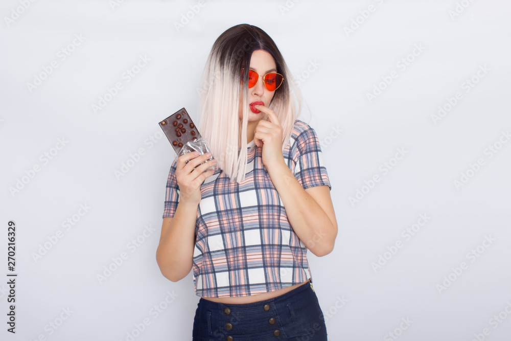 Blonde woman holding chocolate with nuts Blonde woman holding chocolate with nuts