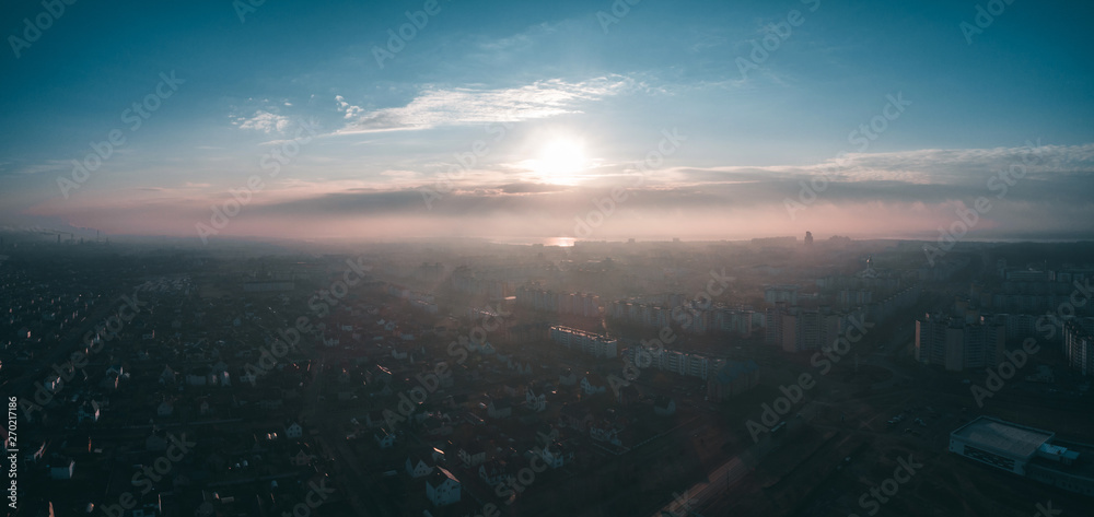 dawn and misty morning over the city