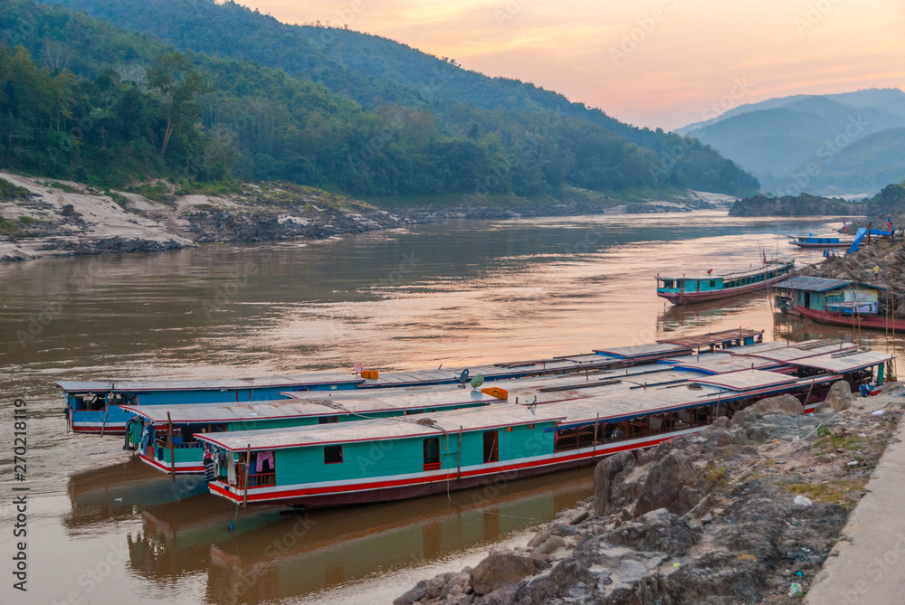 Naklejka premium Long boat on Mekong river, Laos