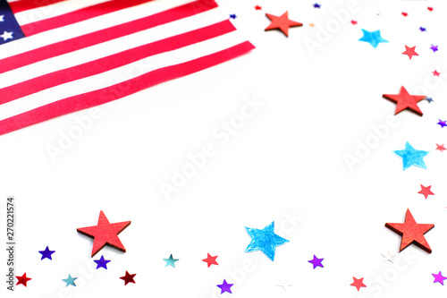 American independence day, celebration, patriotism and holidays concept - red and blue paper stars confetti and flag