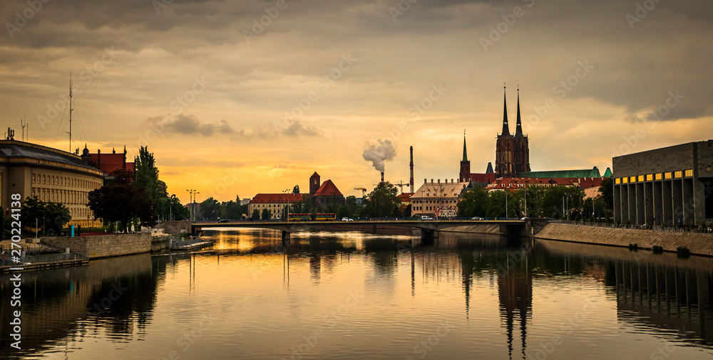View of St. John the Baptist cathedral and other historic buildings in old town Wroclaw from Oder (Odra) river