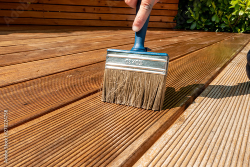 Brush lies on the wet terrace with glaze photo