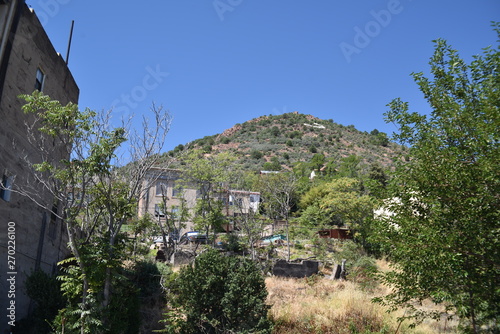 Jerome, AZ. U.S.A. May 18, 2018. A National Historical Landmark 1967. Main street on Jerome’s Cleopatra hill tunnel copper mining boom 1890s to bust 1950s.  photo