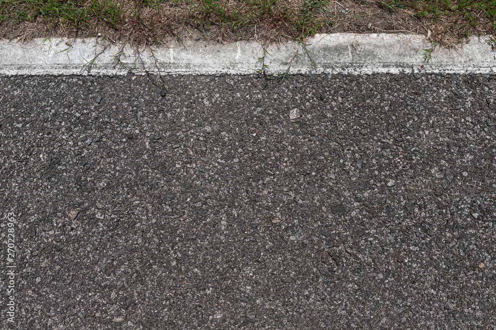 Fototapeta premium Asphalt road with stripes and green grass texture Background,empty copy space.