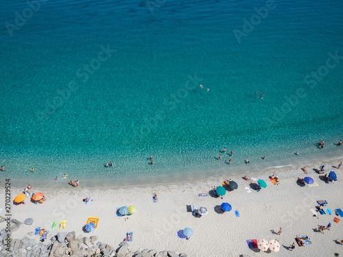 Aerial view of the beach of Tropea, the amazing seaside place in Calabria, Italy. The shot is taken during a beautiful sunny summer day