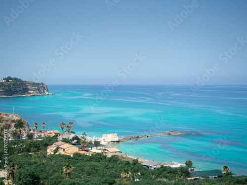 Fototapeta Naklejka Na Ścianę i Meble -  Aerial view of the beach of Tropea, the amazing seaside place in Calabria, Italy. The shot is taken during a beautiful sunny summer day