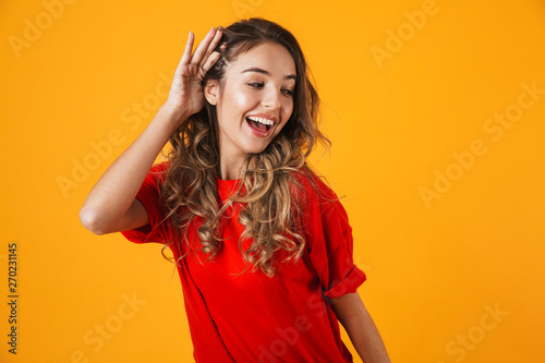 Portrait of a lovely cheerful young woman standing