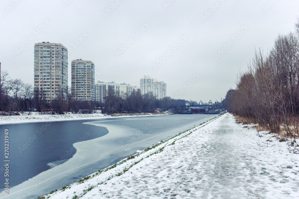 winter landscape with road and buildings, moscow canal