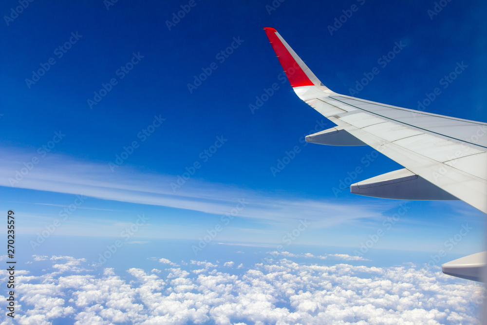 Sky wings and white clouds flying over Phuket, Thailand Sky wings and white clouds flying over Phuket, Thailand