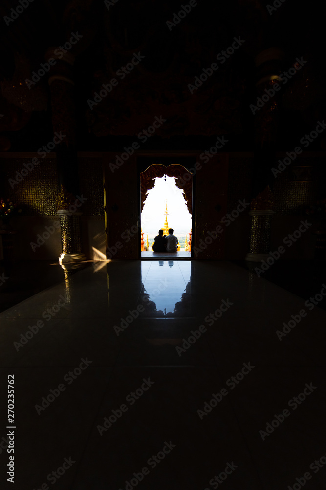 Fototapeta premium Temple on the top of the mountain in buddhist temple is beautiful buddha and sparkling light to statue, Lampang Province, Thailand