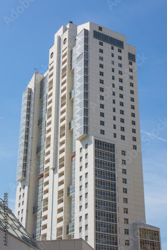 Modern residential multi-storey house against the blue Sky