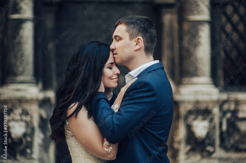 Bride and Groom on Wedding Day in city. Wedding couple after wedding ceremony.