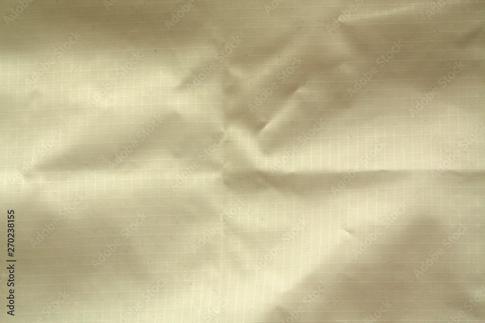 Naklejka premium Yellow color crumpled transparent plastic surface.