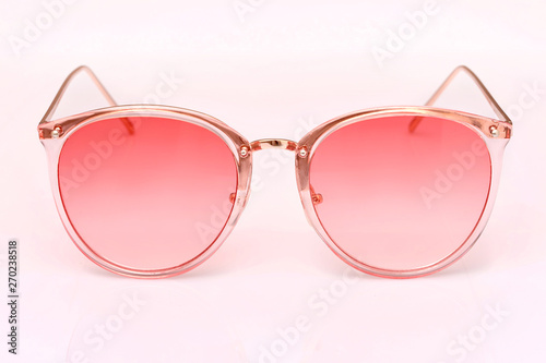 modern women's sunglasses with pink glasses isolated on white