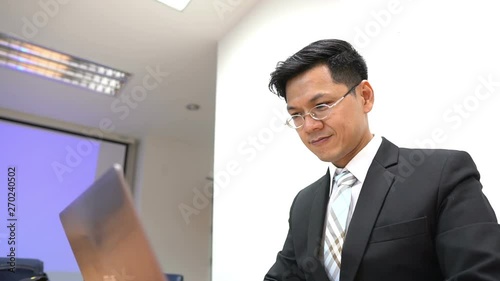 Wallpaper Mural  Asian businessman working with serious,Thailand people,Stress man concept Torontodigital.ca