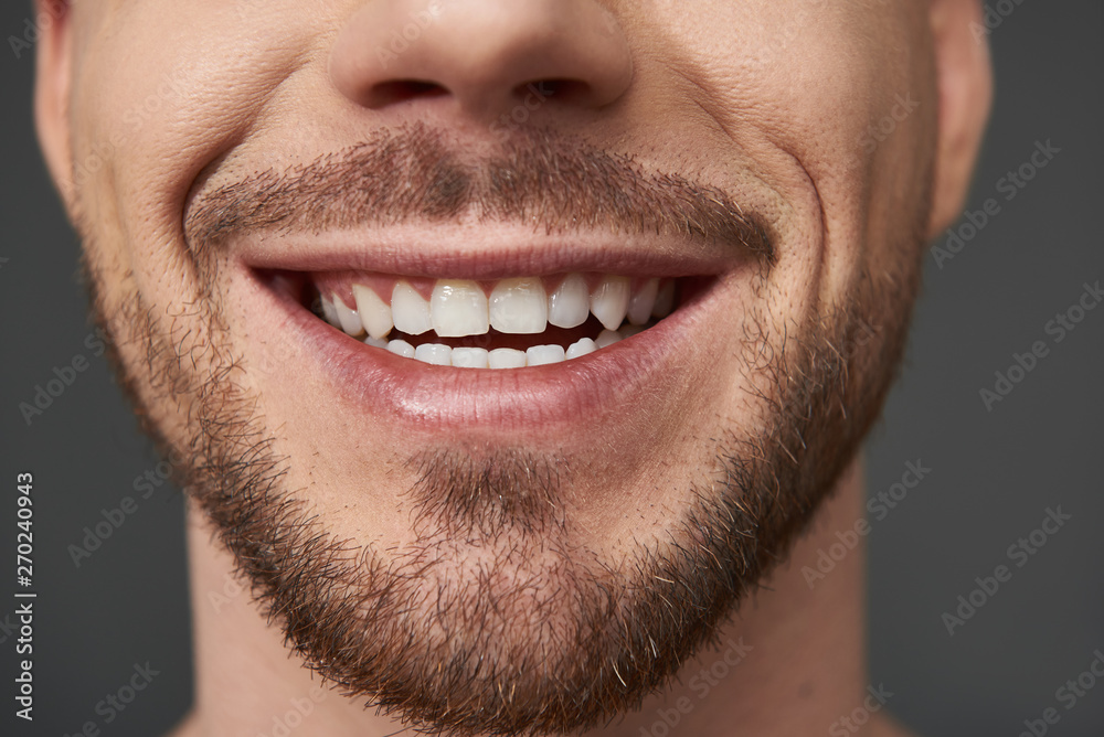 Close up of handsome bearded young man posing for camera in studio Close up of handsome bearded young man posing for camera in studio