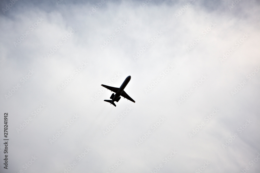 The airplane flies in the clouds.The plane flies in the clouds. bird`s eye view The airplane flies in the clouds.The plane flies in the clouds. bird`s eye view