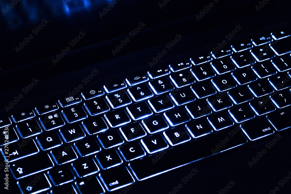 Blue light colour black keyboard with copy space Blue light colour black keyboard with copy space