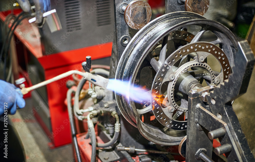 Obraz premium Repair and maintenance of motorcycle wheels on the service.