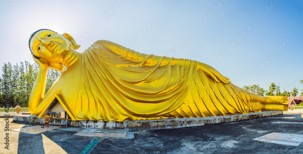 Lying Buddha statue made with blue sky background