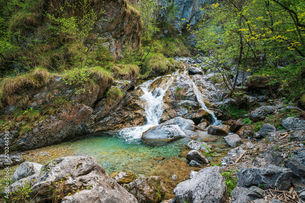 Awesome view of the Vertova torrent at sunset, in the middle of the Orobiche mountains with its beautiful tiny waterfalls. Awesome view of the Vertova torrent at sunset, in the middle of the Orobiche mountains with its beautiful tiny waterfalls.