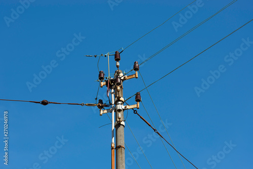 Electricity Pylon Against Blue Sky.