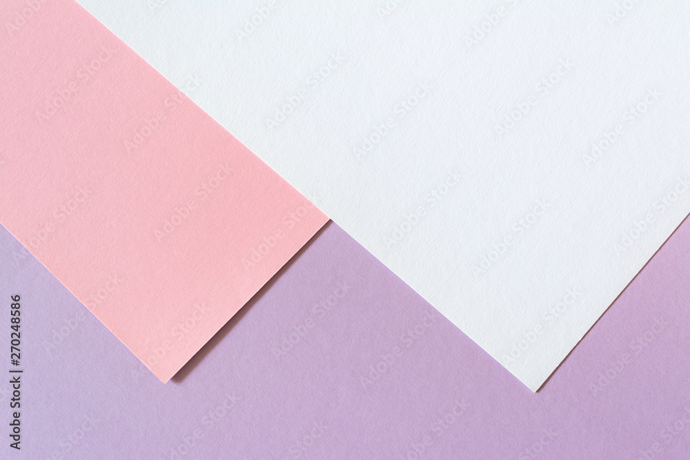 Multicolored paper background with trendy coral color of the year 2019. Abstract colorful paper background with soft light trendy coral color.