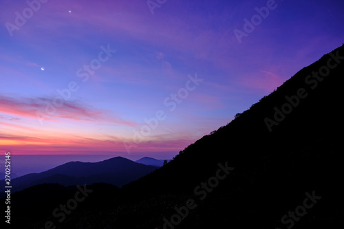 Twilight light pink and purple colors beautifully. reflect the views Mountains and fog in the morning. Khao Jed Yod, Trang in Thailand.