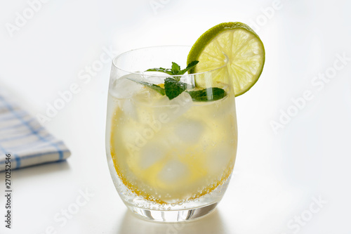 Mineral water with lemon in a steaming glass