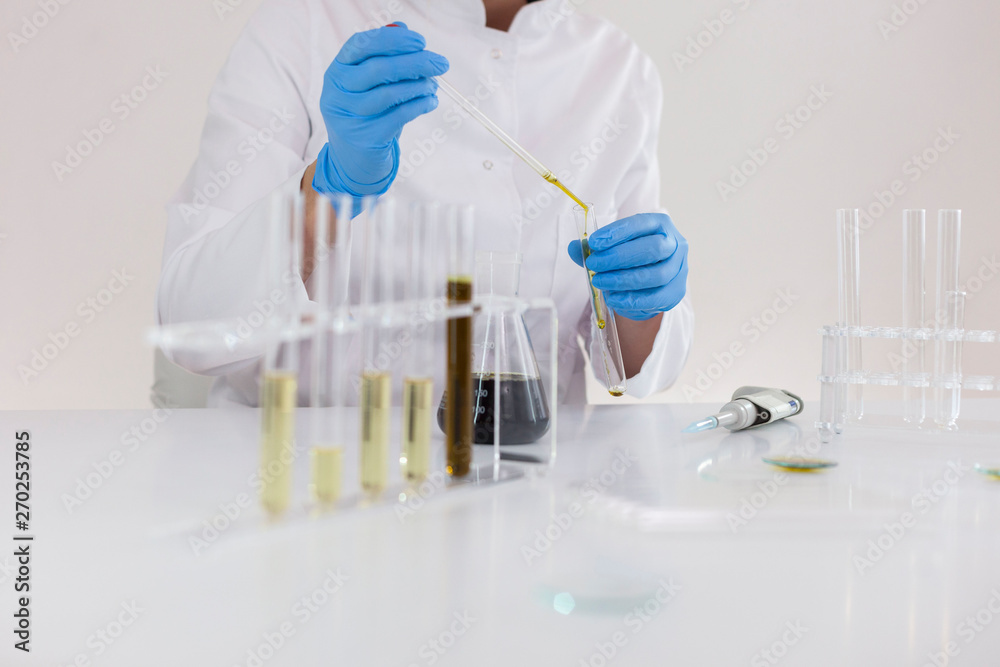Fototapeta premium Experimental titration of the CBD oil in a glass tube