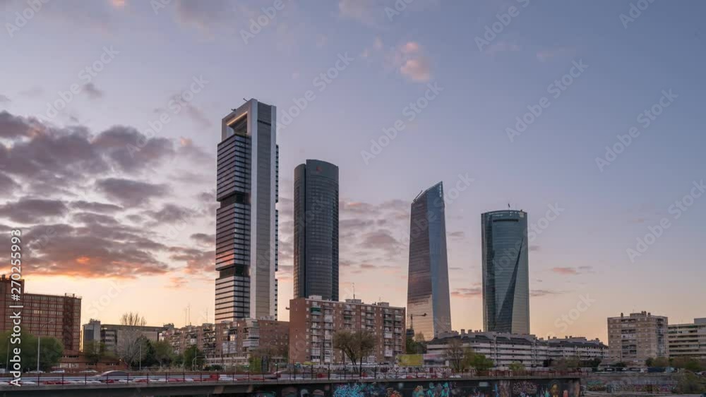 Madrid Spain time lapse 4K, city skyline day to night sunset timelapse at financial district four towers Madrid Spain time lapse 4K, city skyline day to night sunset timelapse at financial district four towers